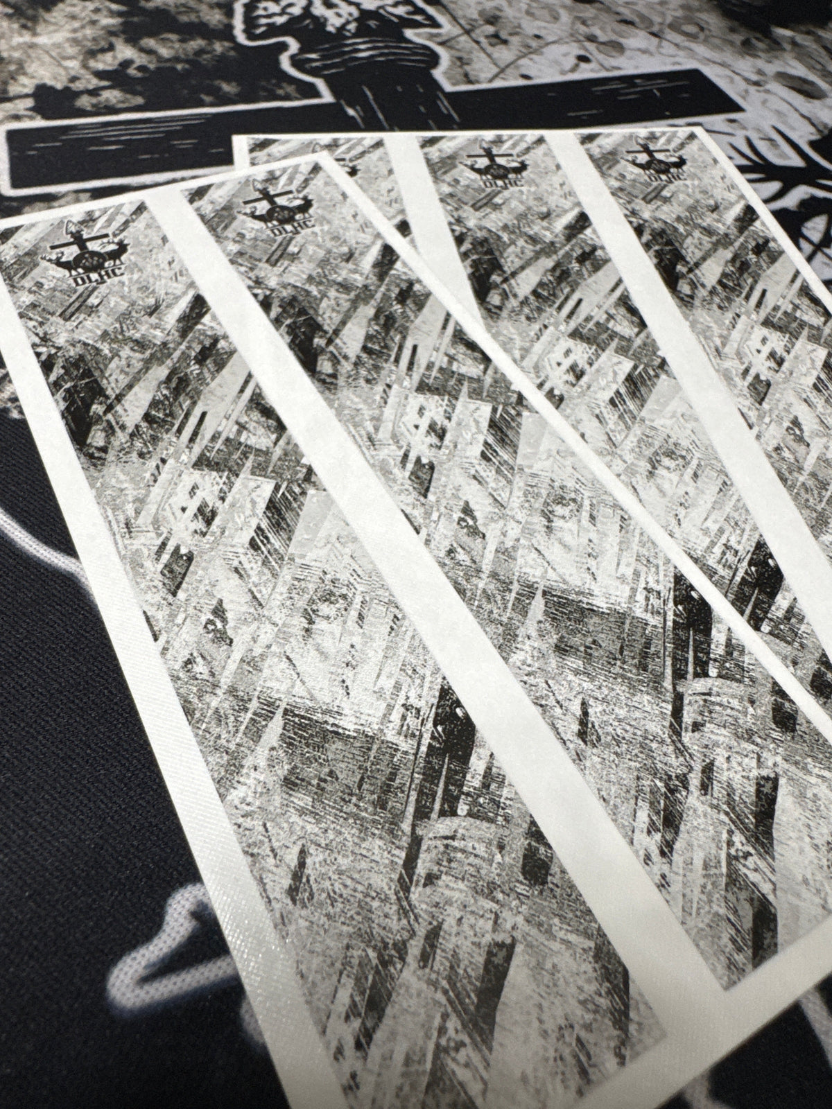 Shattered cosmetic product packaging, featuring fragmented glass-like pieces in deep blues and blacks.