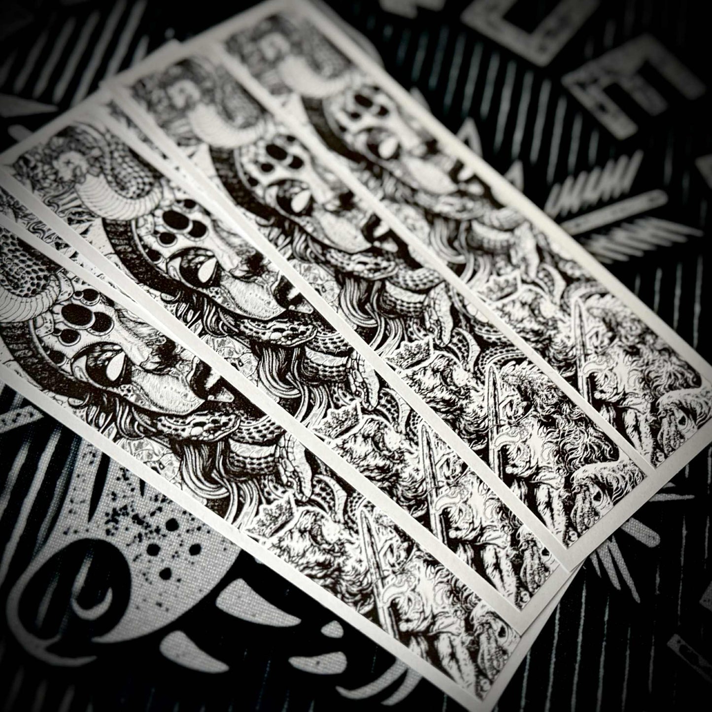 Black and white "FALLEN KINGS" arrow wraps featuring intricate, detailed, gothic-style artwork.