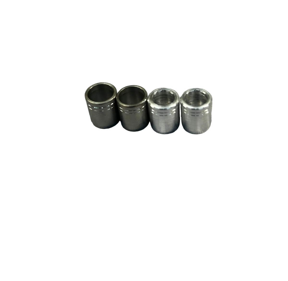 Set of four silver metal nock collars, cylindrical, for archery equipment.