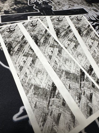 Shattered cosmetic product packaging, featuring fragmented glass-like pieces in deep blues and blacks.