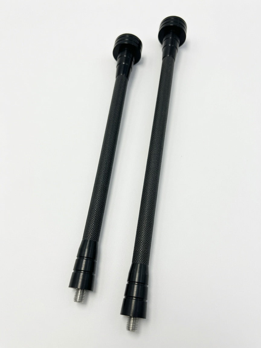 Two black OryX Micro Pro stabilizers, featuring knurled shafts and threaded ends.