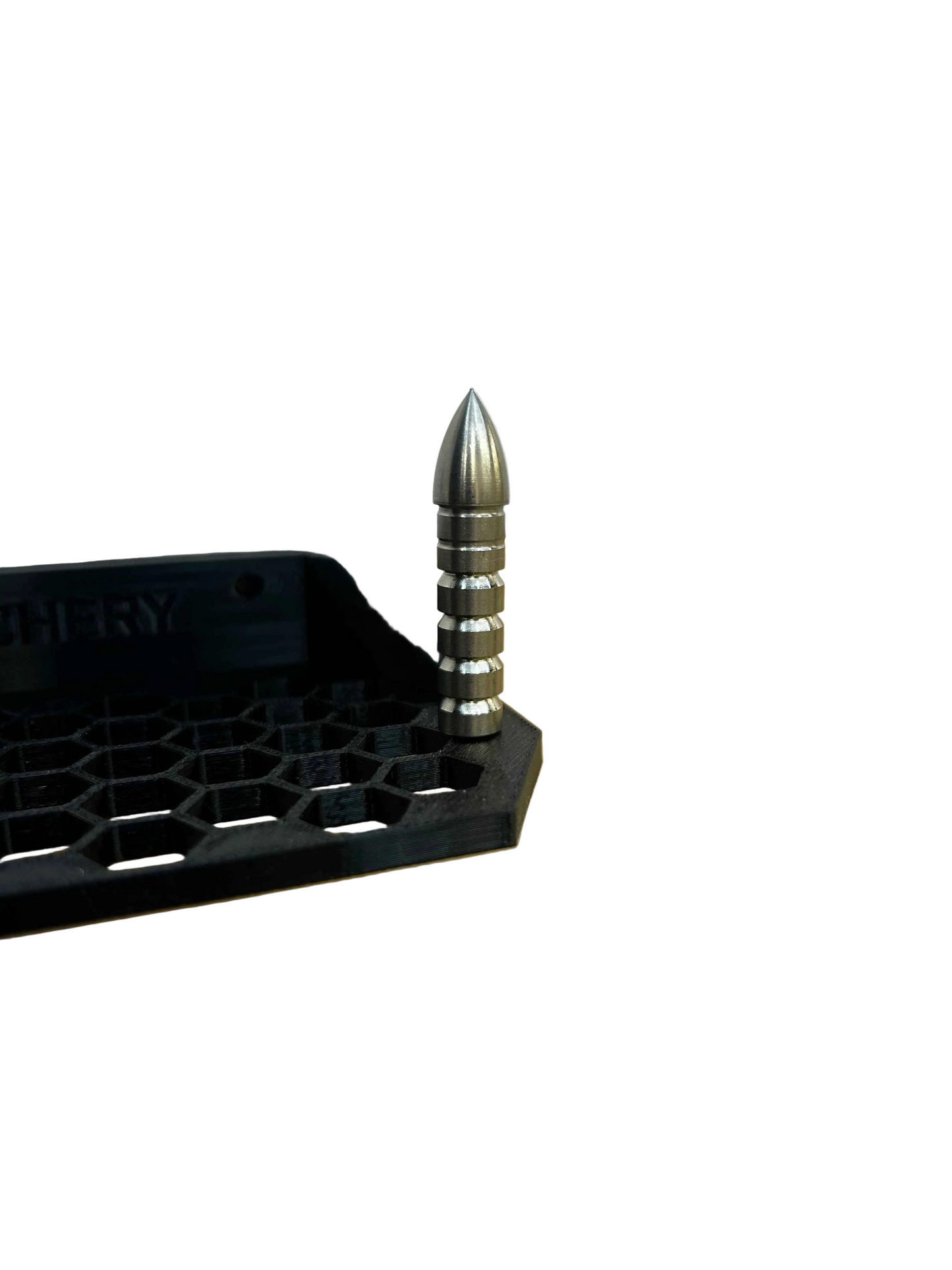 Glue point with a metal pin, shown next to a black, hexagonal base.