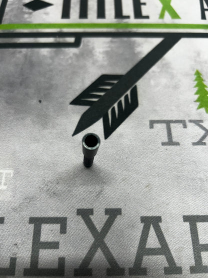 Small, black aluminum arrow point, 20 grain .204, resting on a printed map background.