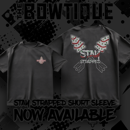 Black graphic tee featuring "STAY STRAPPED" design. Short sleeve t-shirt.