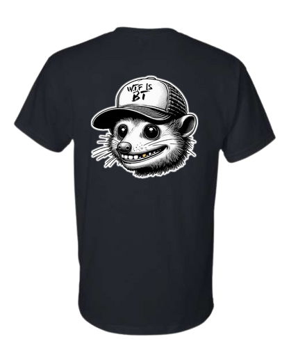 Black t-shirt featuring a graphic of a raccoon wearing a cap that reads "WTF IS BT?". | titlex-cutout