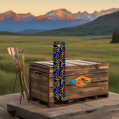 Comic Pop Arrow Wrap on weathered wood, set against golden aspens and distant mountains at sunset. | titlex-scene-western-elk